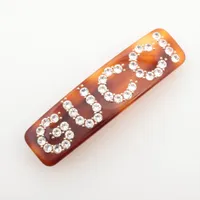 PRADA アイボリー ストーン付きバレッタ プラダ ロゴ バレッタ レジン×GP×ラインストーン アイボリー