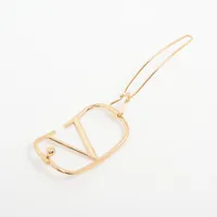 ヴァレンティノ　ヘアクリップ Vロゴ シグネチャー レジン X メタル X クリスタル ヘアクリップ
