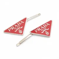 プラダ ロゴ バレッタ レジン×GP×ラインストーン ピンク A2533686