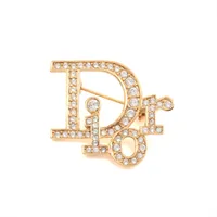 クリスチャンディオール Diorロゴ ブローチ GP×ラインストーン 
