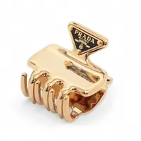 プラダ トライアングルロゴ ヘアクリップ GP ゴールド×ブラック