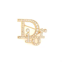 クリスチャンディオール Diorロゴ ブローチ GP×ラインストーン