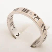 ティファニー ピアスド アトラス 4P ダイヤ リング 750(WG)