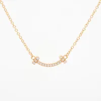 ティファニー Tスマイル ミニ ダイヤ 750(YG)