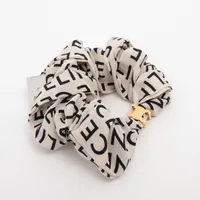 CELINE シルクシュシュ ベージュ・ブラック 240502sa0400031.jpg