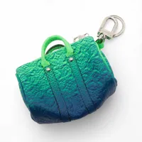 ヴィトン ポルトクレミニキーポル MP3284 GP×革 チャーム CX1212 グリーン×ブルー